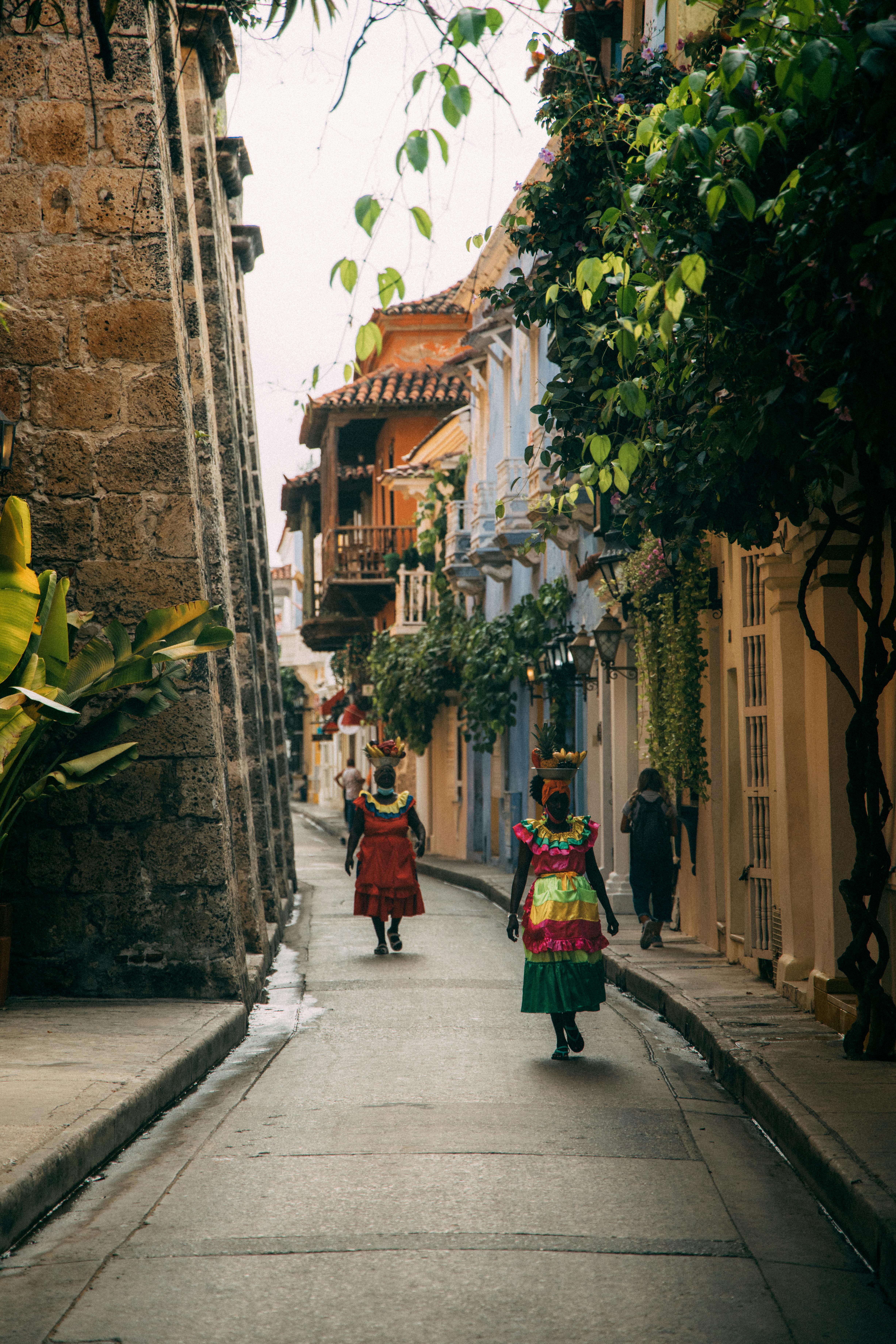 Travelers exploring the colorful colonial streets of Cartagena's walled city
